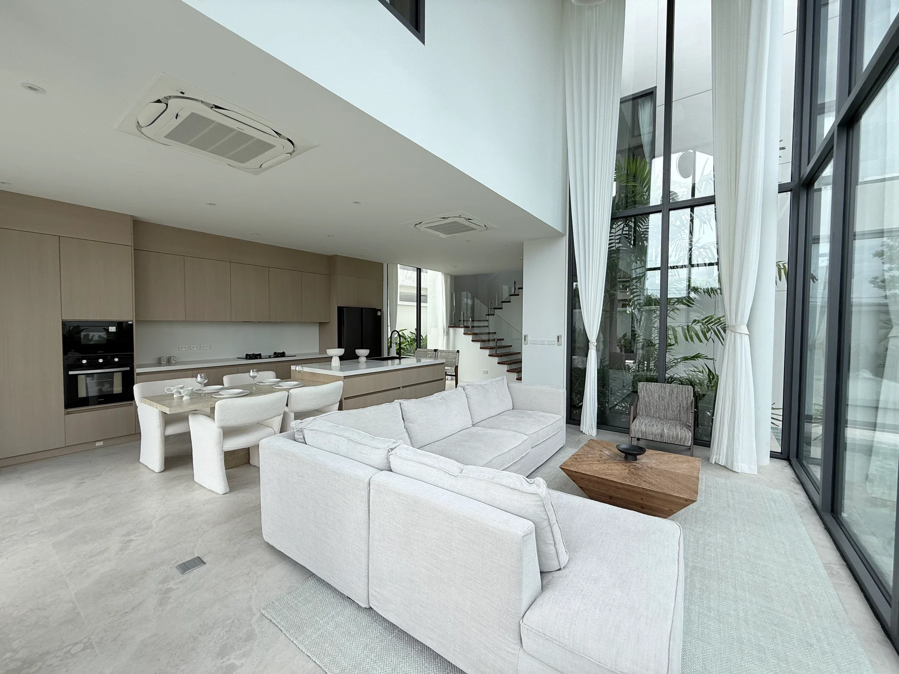 Living, dining and fitted kitchen in the show villa