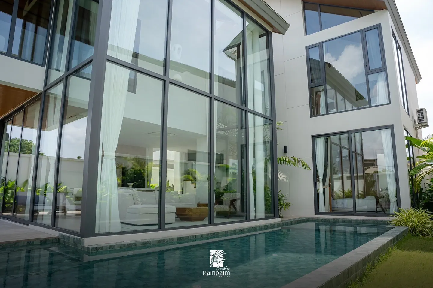 Two-storey glass facade above the pool